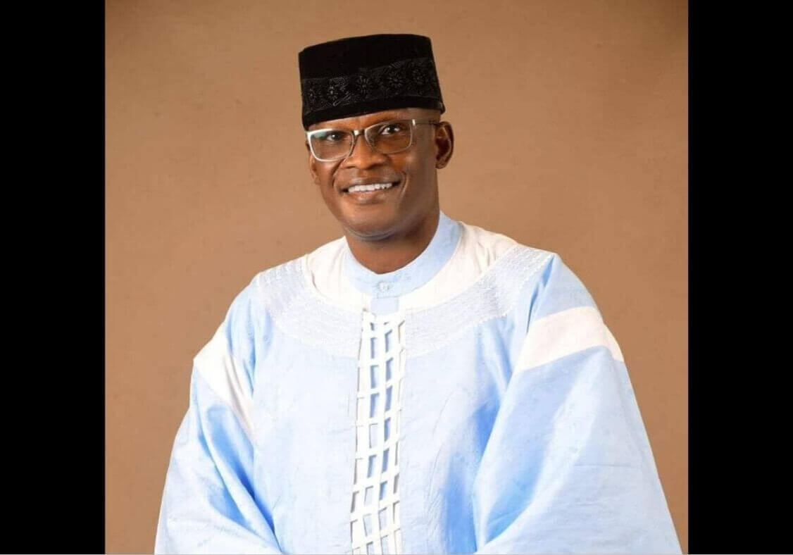 Elisha Mac Phillips Dudu smiles while wearing Nigerian dress